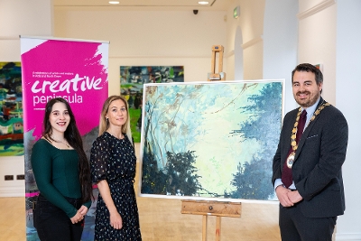 The Mayor of Ards and North Down, Councillor Alistair Cathcart with Maria Horvathova, Creative Peninsula Cover Artist and Emily Crawford, Arts and Heritage Manager, Ards and North Down Borough Council